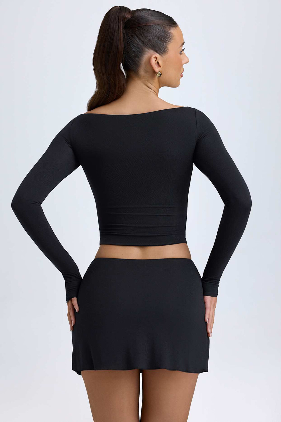 modal minirok met knoopdetails en lage taille in zwart