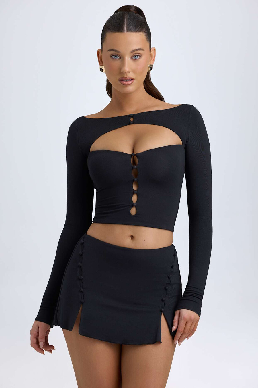 modal minirok met knoopdetails en lage taille in zwart