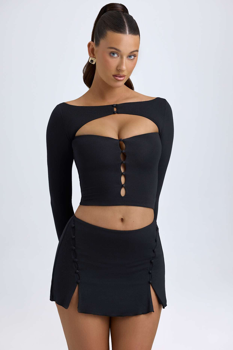 modal minirok met knoopdetails en lage taille in zwart