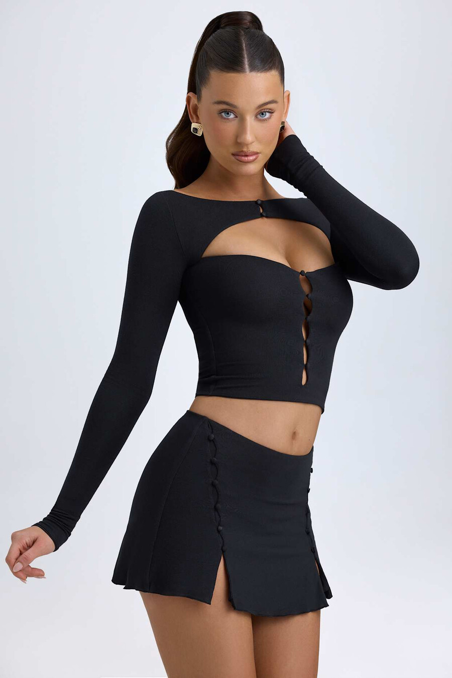 modal minirok met knoopdetails en lage taille in zwart