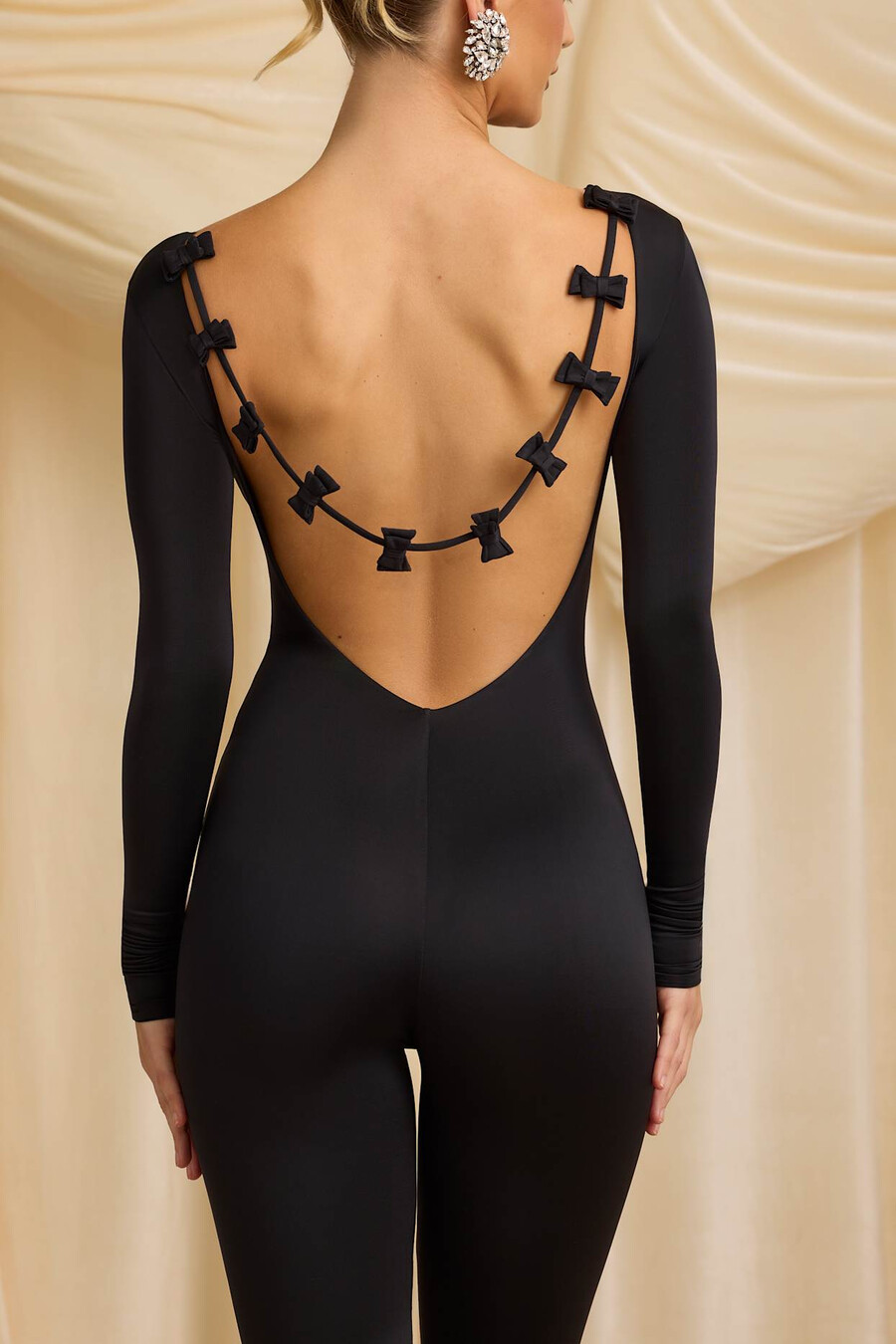 nauwsluitende jumpsuit van jersey met strikdetail in zwart