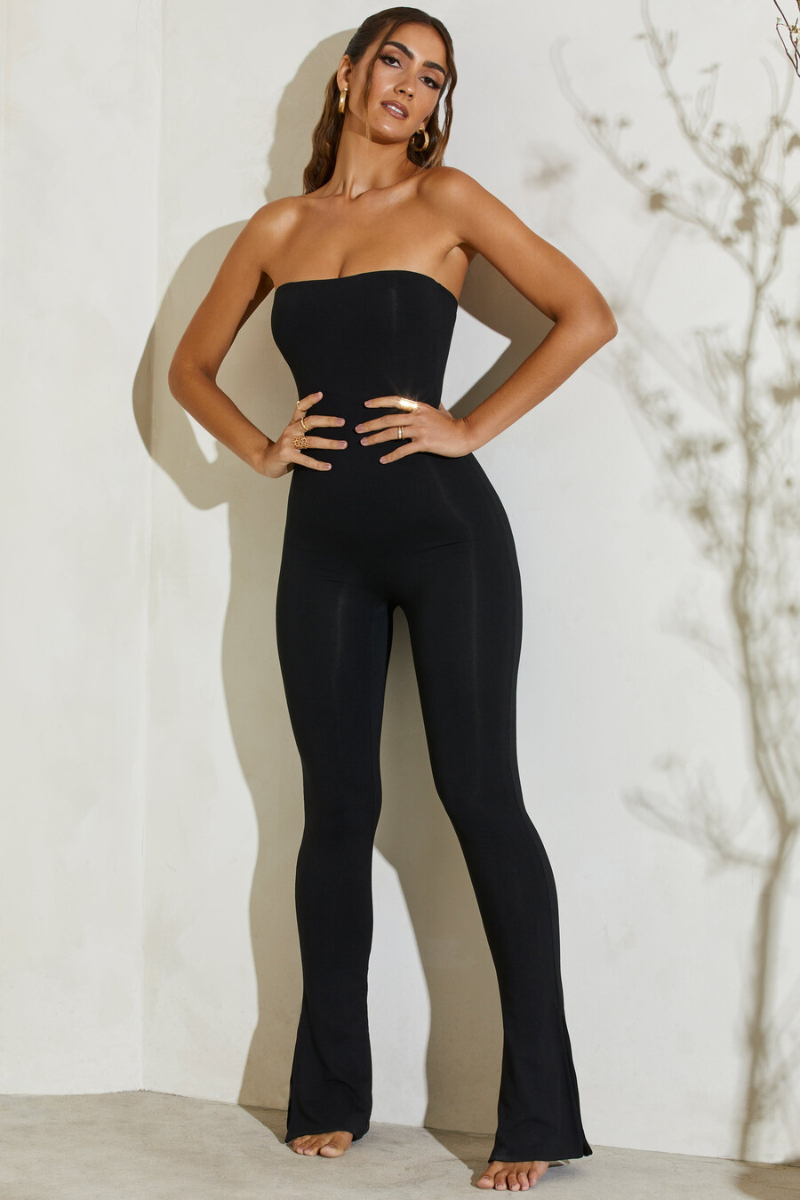 strapless jumpsuit met uitlopende zoom in zwart