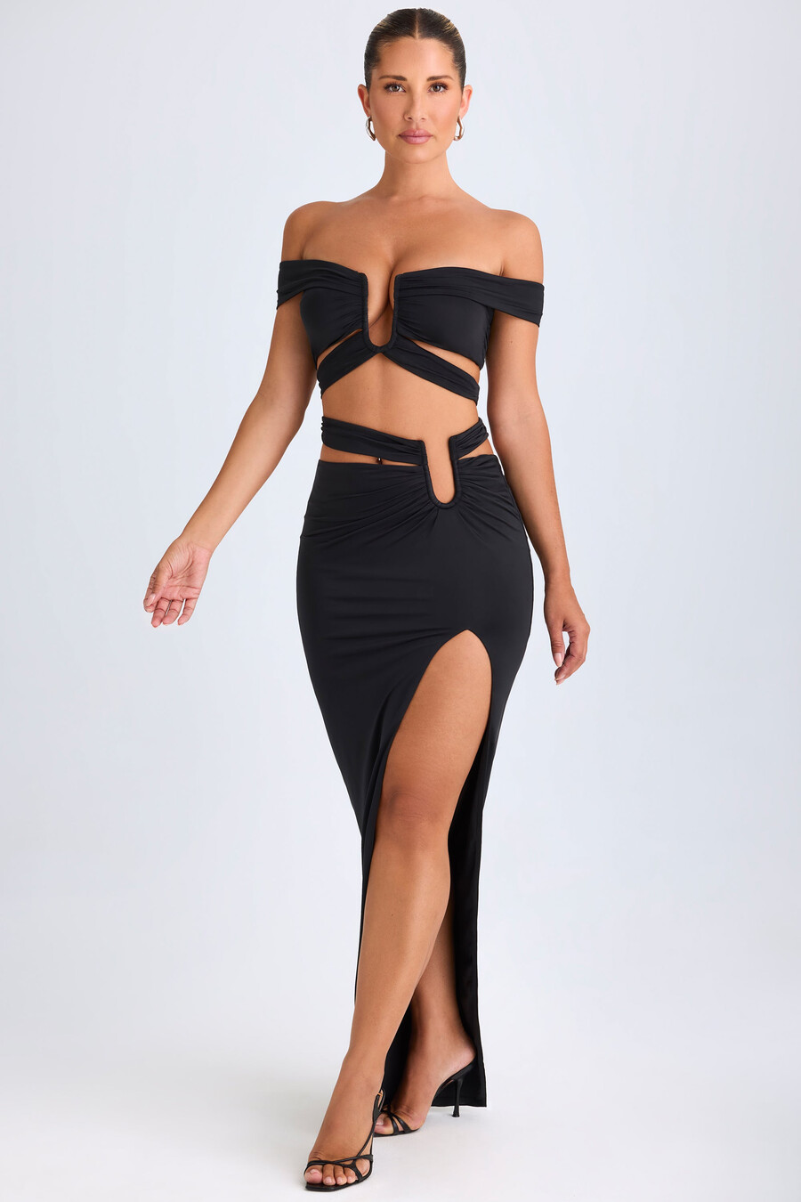 asymmetrische maxi-rok met uitsnijdingen in zwart