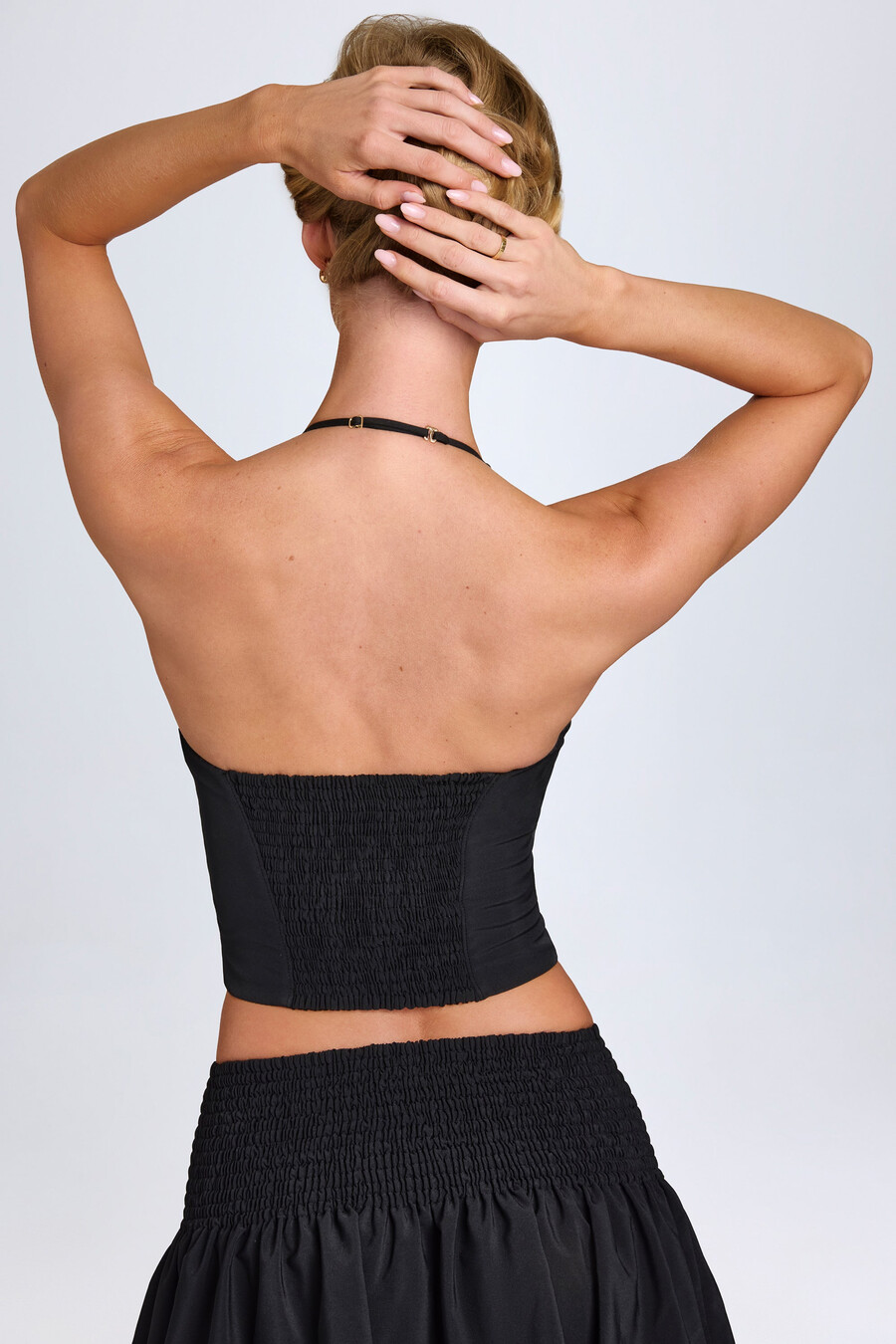 corsettop met halternek en haaksluiting in zwart