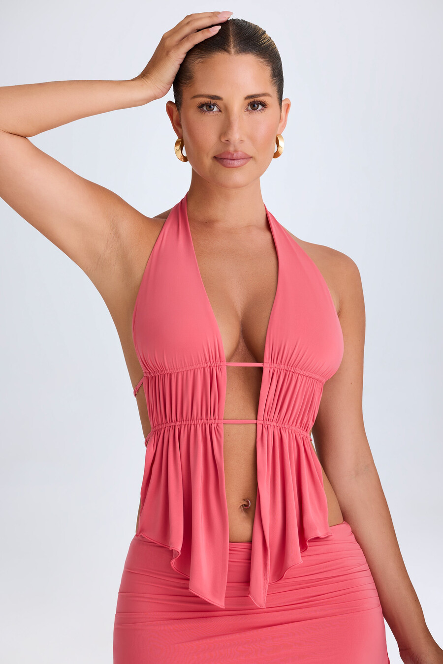 crop top met halternek en uitsnijdingen in koraalrood