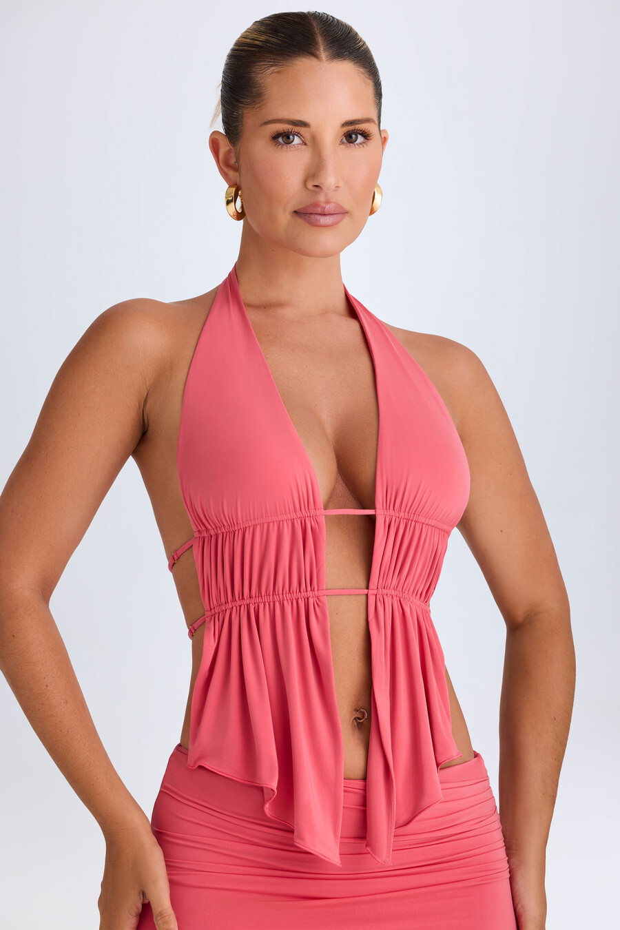 crop top met halternek en uitsnijdingen in koraalrood